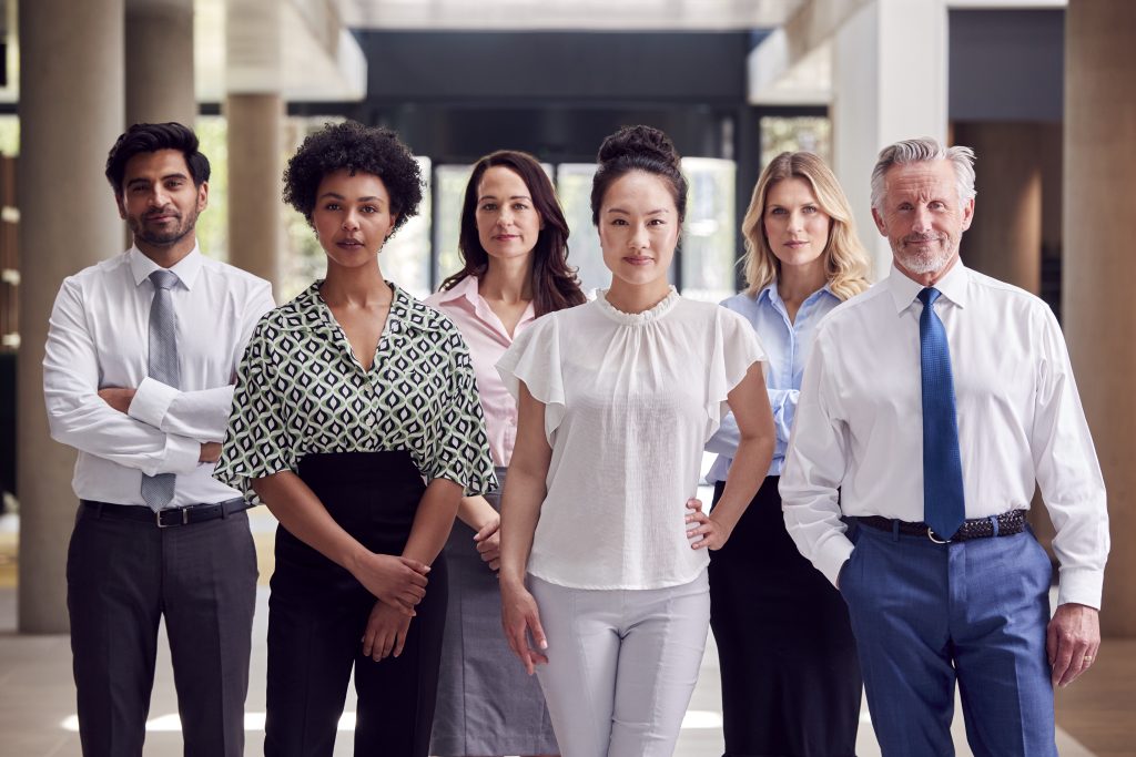 portrait of multi cultural business team inside modern office building