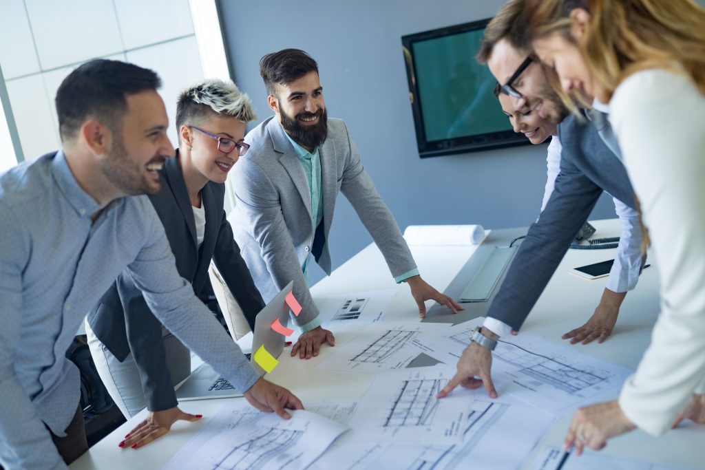 team of architects working on construction plans